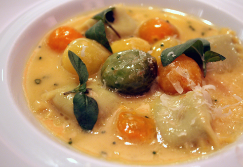 Plump agnolotti with mascarpone and peeled toybox tomatoes.