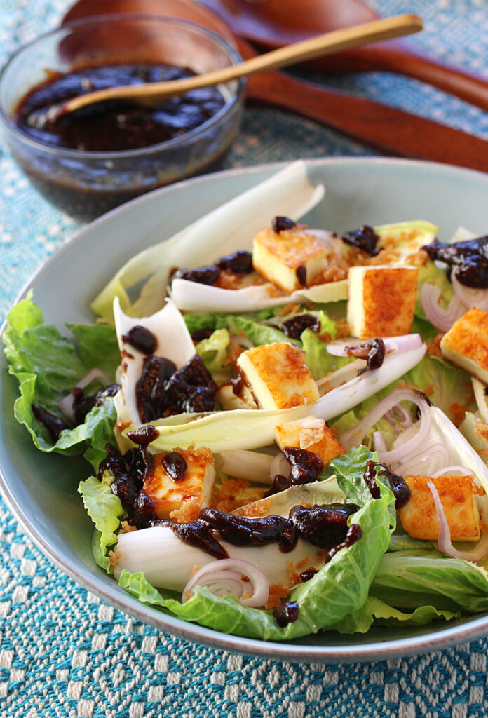 An endive and romaine salad gets jazzed up with seared paneer and a punchy tamarind chutney dressing.