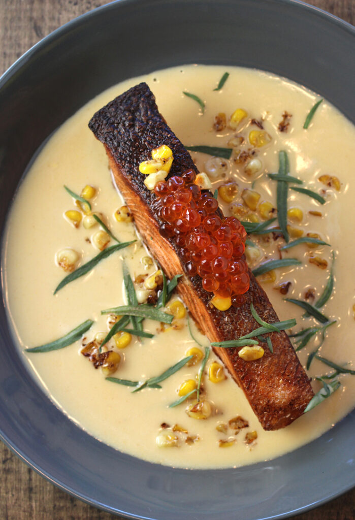 A restaurant-quality salmon and corn dish.