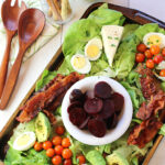 "A Cobb Salad for Sharing'' with "Smoky Blue Cheese Dressing,'' and homemade "Herbes de Provence Grissini'' make for an impressive spread.