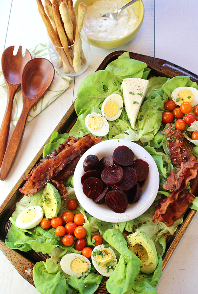 "A Cobb Salad for Sharing'' with "Smoky Blue Cheese Dressing,'' and homemade "Herbes de Provence Grissini'' make for an impressive spread.