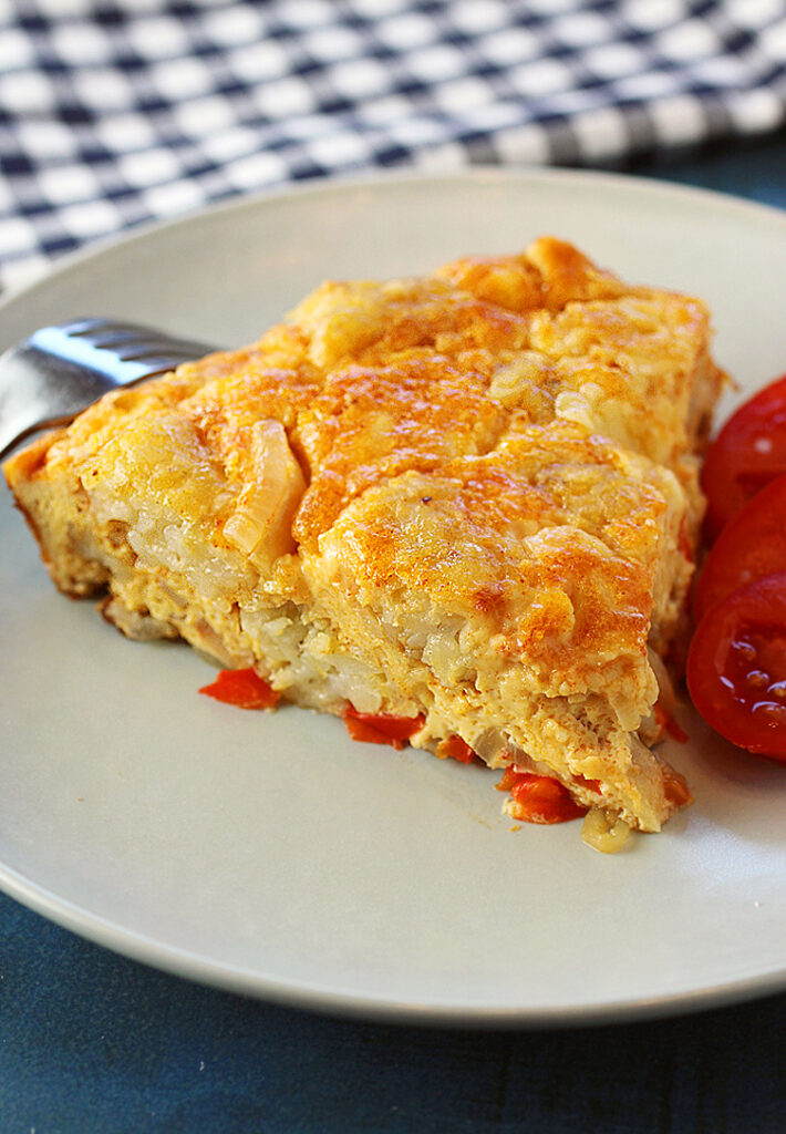 Like a Spanish tortilla or crustless quiche -- with tater tots inside.