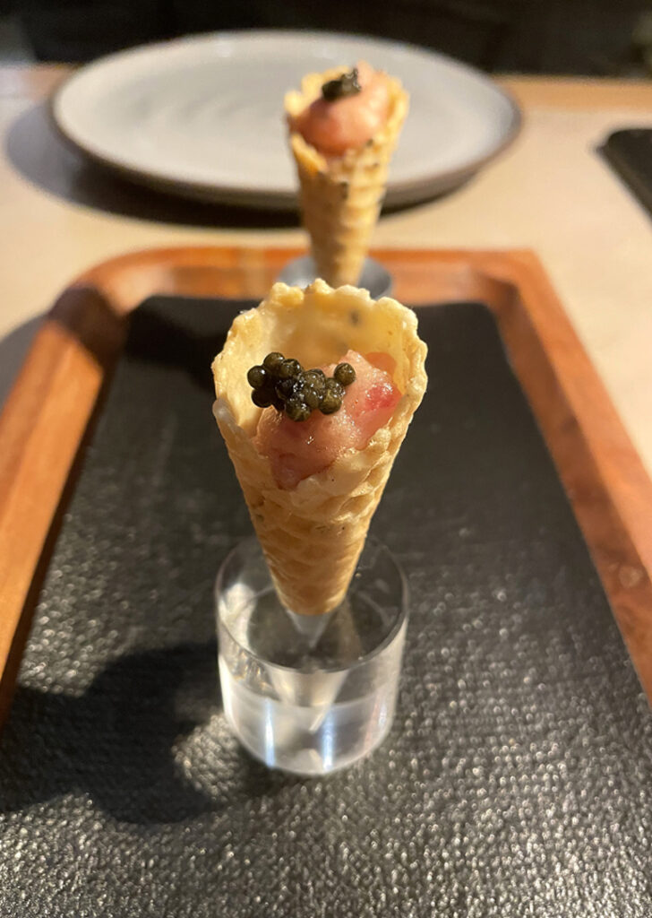 An amuse of teeny tuna tartare cones greets every diner at the new Eos & Nyx.