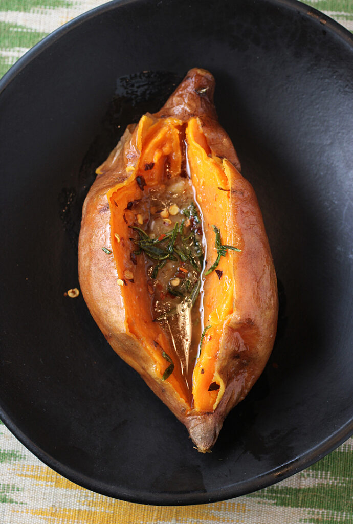 Whole roasted sweet potatoes get jazzed up with miso and bourbon.