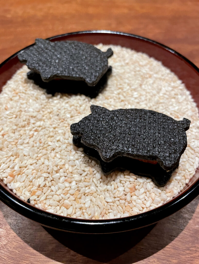 Playful squid-ink crackers filled with chorizo at Michelin-starred Koke in Kyoto.