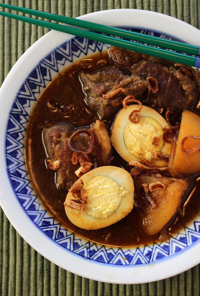 Syrupy Indonesian soy sauce flavors this saucy pork dish.